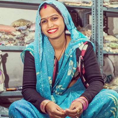 Artisan at Daughters of the Ganges in a blue sari