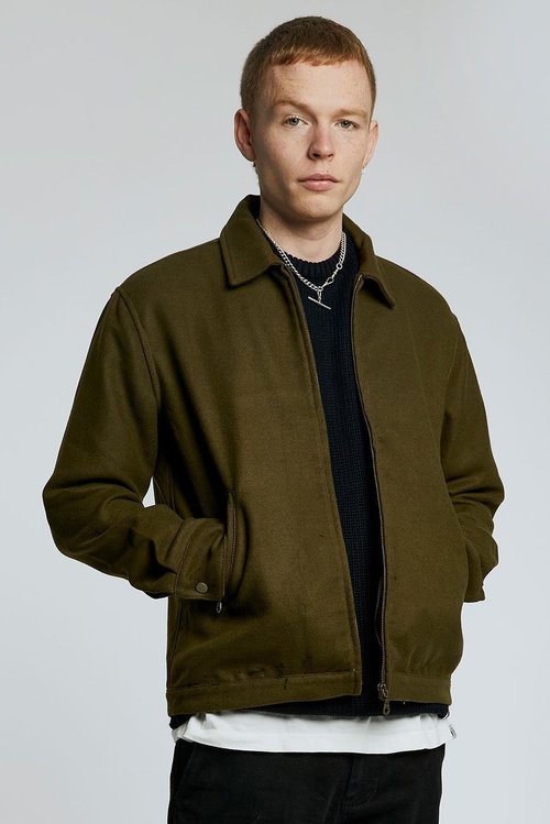 man wearing recycled pet jacket in olive green