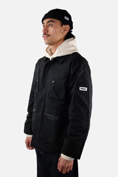 man wearing military style organic cotton jacket in black