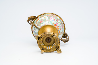 A Chinese Canton famille rose bowl with gilt bronze mounts, 19th C.