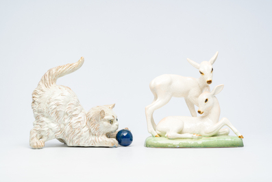 J. Filmont (second quarter 20th C.): A playing cat and a 'deer' group in polychrome decorated porcelain, Goldscheider, 20th C.