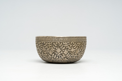 A Thai or Chinese floral silver bowl bearing an inscription and a mark, 19th/20th C.