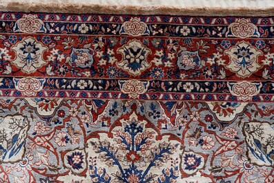 A Sino-Isfahan silk rug with a tree of life, 20th C.