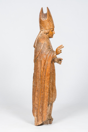 A large carved oak figure of a bishop, 17th/18th C.