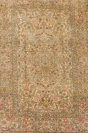 A Turkish silk Hereke rug with floral design, 20th C.