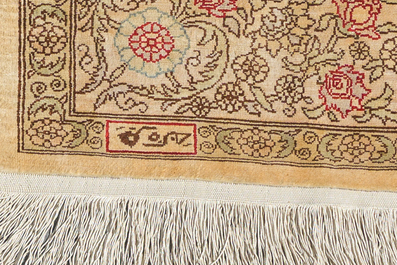 A Turkish silk Hereke rug with floral design, 20th C.