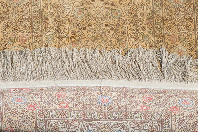 A Turkish silk Hereke rug with floral design, 20th C.