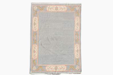 A Nepalese wool Kangri rug with floral design, 20th C.