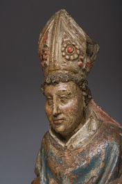 A Flemish polychromed wooden sculpture of a bishop, possibly Saint Nicholas, 16th C.