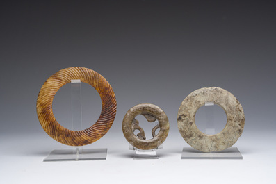 Three jade and/or hardstone discs or bracelets, China and Thailand, probably Jin Dynasty and later