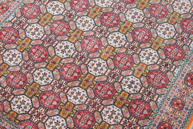 Deux tapis orientaux de type Qom (Qum/Ghom) &agrave; d&eacute;cor floral et d'animaux parmi des branches fleuries, laine sur coton, 20&egrave;me si&egrave;cle