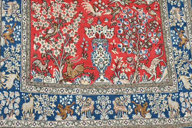 Deux tapis orientaux de type Qom (Qum/Ghom) &agrave; d&eacute;cor floral et d'animaux parmi des branches fleuries, laine sur coton, 20&egrave;me si&egrave;cle