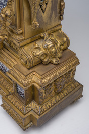 Pendule de chemin&eacute;e en bronze dor&eacute; surmont&eacute;e d'un buste de dame et d&eacute;cor&eacute;e par des plaques d'&eacute;mail &agrave; mascarons, France, 19&egrave;me si&egrave;cle