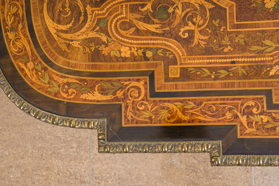 A French Napoleon III gilt bronze mounted partially ebonized wooden marquetry table with floral design and a theatre, 19th C.