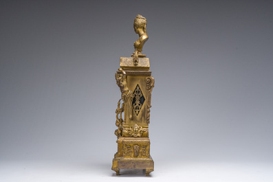 Pendule de chemin&eacute;e en bronze dor&eacute; surmont&eacute;e d'un buste de dame et d&eacute;cor&eacute;e par des plaques d'&eacute;mail &agrave; mascarons, France, 19&egrave;me si&egrave;cle