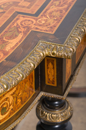 A French Napoleon III gilt bronze mounted partially ebonized wooden marquetry table with floral design and a theatre, 19th C.