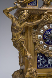 Pendule de chemin&eacute;e en bronze dor&eacute; surmont&eacute;e d'un buste de dame et d&eacute;cor&eacute;e par des plaques d'&eacute;mail &agrave; mascarons, France, 19&egrave;me si&egrave;cle