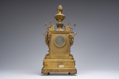 Pendule de chemin&eacute;e en bronze dor&eacute; surmont&eacute;e d'un buste de dame et d&eacute;cor&eacute;e par des plaques d'&eacute;mail &agrave; mascarons, France, 19&egrave;me si&egrave;cle
