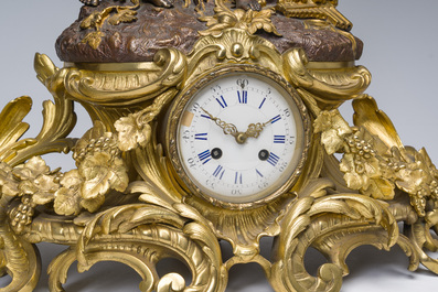 Impressionnante garniture de chemin&eacute;e en trois pi&egrave;ces en bronze dor&eacute; et patin&eacute; &agrave; d&eacute;cor de bacchante et bacchantes, France, 19&egrave;me si&egrave;cle