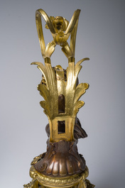 Impressionnante garniture de chemin&eacute;e en trois pi&egrave;ces en bronze dor&eacute; et patin&eacute; &agrave; d&eacute;cor de bacchante et bacchantes, France, 19&egrave;me si&egrave;cle