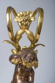 Impressionnante garniture de chemin&eacute;e en trois pi&egrave;ces en bronze dor&eacute; et patin&eacute; &agrave; d&eacute;cor de bacchante et bacchantes, France, 19&egrave;me si&egrave;cle