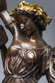 Impressionnante garniture de chemin&eacute;e en trois pi&egrave;ces en bronze dor&eacute; et patin&eacute; &agrave; d&eacute;cor de bacchante et bacchantes, France, 19&egrave;me si&egrave;cle