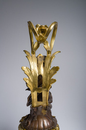 Impressionnante garniture de chemin&eacute;e en trois pi&egrave;ces en bronze dor&eacute; et patin&eacute; &agrave; d&eacute;cor de bacchante et bacchantes, France, 19&egrave;me si&egrave;cle