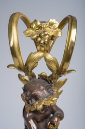Impressionnante garniture de chemin&eacute;e en trois pi&egrave;ces en bronze dor&eacute; et patin&eacute; &agrave; d&eacute;cor de bacchante et bacchantes, France, 19&egrave;me si&egrave;cle