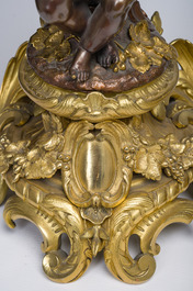 Impressionnante garniture de chemin&eacute;e en trois pi&egrave;ces en bronze dor&eacute; et patin&eacute; &agrave; d&eacute;cor de bacchante et bacchantes, France, 19&egrave;me si&egrave;cle