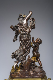 Impressionnante garniture de chemin&eacute;e en trois pi&egrave;ces en bronze dor&eacute; et patin&eacute; &agrave; d&eacute;cor de bacchante et bacchantes, France, 19&egrave;me si&egrave;cle