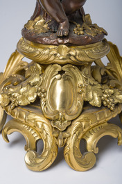 Impressionnante garniture de chemin&eacute;e en trois pi&egrave;ces en bronze dor&eacute; et patin&eacute; &agrave; d&eacute;cor de bacchante et bacchantes, France, 19&egrave;me si&egrave;cle