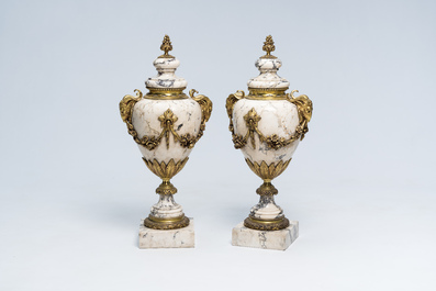 A pair of Neoclassical marble cassolettes mounted with rams' heads and floral garlands, 19th/20th C.