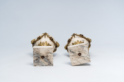 A pair of Neoclassical marble cassolettes mounted with rams' heads and floral garlands, 19th/20th C.