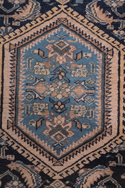 A Persian Hamadan rug with floral design, wool on cotton, 20th C.