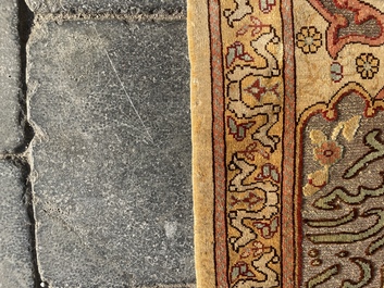 A Turkish Hereke rug with floral design in silk and gold thread, 20th C.