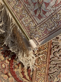 A Turkish Hereke rug with floral design in silk and gold thread, 20th C.