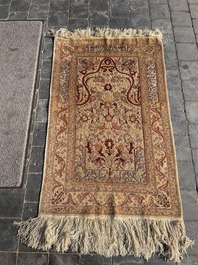 A Turkish Hereke rug with floral design in silk and gold thread, 20th C.