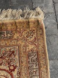 A Turkish Hereke rug with floral design in silk and gold thread, 20th C.