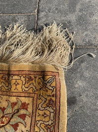 A Turkish Hereke rug with floral design in silk and gold thread, 20th C.