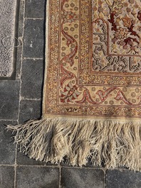 A Turkish Hereke rug with floral design in silk and gold thread, 20th C.