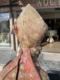 A Flemish polychromed wooden sculpture of a bishop, possibly Saint Nicholas, 16th C.