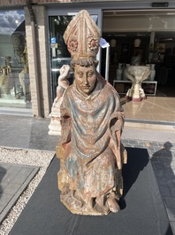 A Flemish polychromed wooden sculpture of a bishop, possibly Saint Nicholas, 16th C.