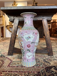 A Chinese famille rose baluster vase with female Immortals and floral design, Qianlong mark, 20th C.