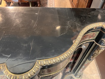A French Historicism gilt bronze mounted tortoiseshell and brass marquetry ebonised wooden Boulle three-door credenza, 19th C.
