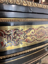 A French Historicism gilt bronze mounted tortoiseshell and brass marquetry ebonised wooden Boulle three-door credenza, 19th C.