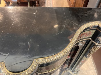 A French Historicism gilt bronze mounted tortoiseshell and brass marquetry ebonised wooden Boulle three-door credenza, 19th C.