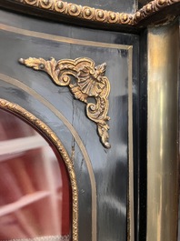 A French Historicism gilt bronze mounted tortoiseshell and brass marquetry ebonised wooden Boulle three-door credenza, 19th C.