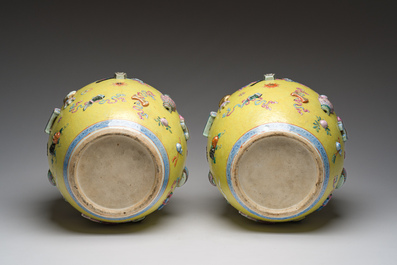 An exceptional pair of Chinese famille rose yellow sgraffito-ground bottle vases with applied design of antiquities, 19th C.