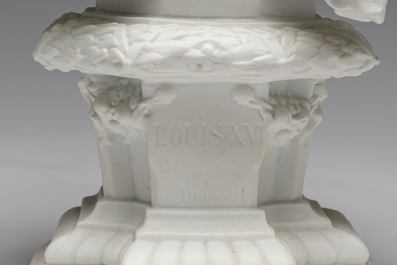 A pair of biscuit busts of Louis XVI and Marie-Antoinette and a patinated 'Cupid' group after Pigalle, 19th/20th C.