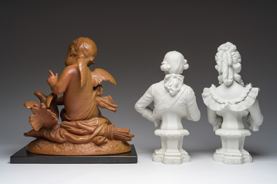 A pair of biscuit busts of Louis XVI and Marie-Antoinette and a patinated 'Cupid' group after Pigalle, 19th/20th C.